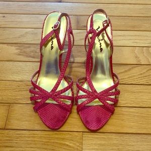 Bright pink, snake skin heels